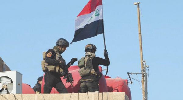 ماذا فعلت قوات الشرطة الاتحادية بعد رفعها العلم العراقي فوق مركز شرطة الخالدية؟